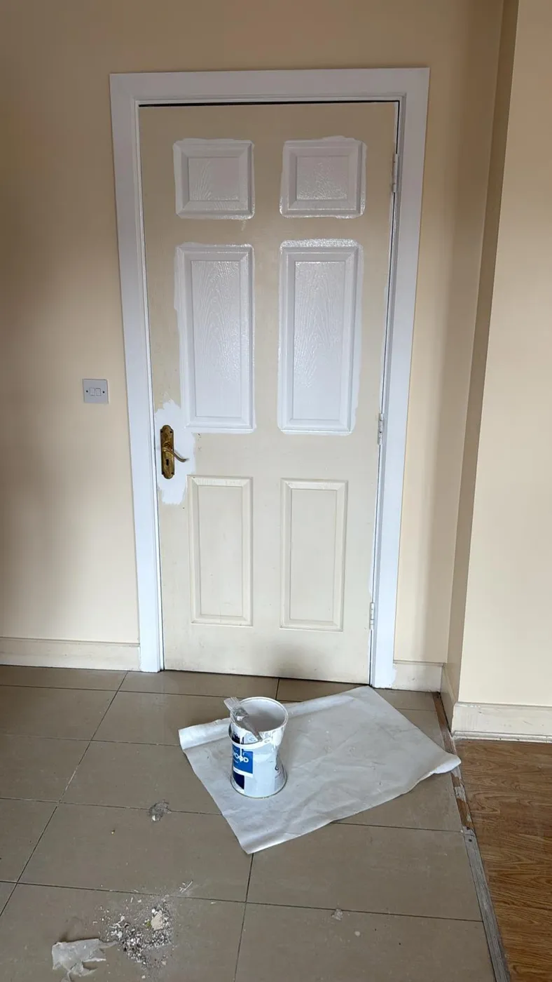 Before and after repainted stairwell with fresh magnolia walls and carpeted stairs in a Dublin home